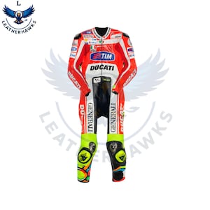 May include: A red and white Ducati racing suit with black accents. The suit features sponsor logos, including "TIM" and "GENERALI." The lower legs are neon green with black and colorful knee protectors. The suit is designed for motorcycle racing.