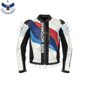 May include: A white and black motorcycle jacket with blue and red detailing. The jacket has the text "BMW MOTORRAD" printed vertically down the front. The sleeves are black and white, and it has a zip closure.