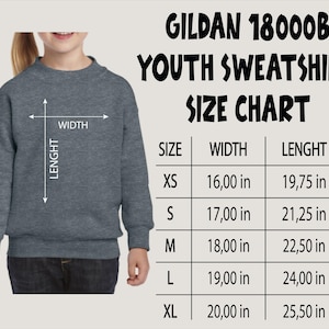 a young girl wearing a sweatshirt with a size chart
