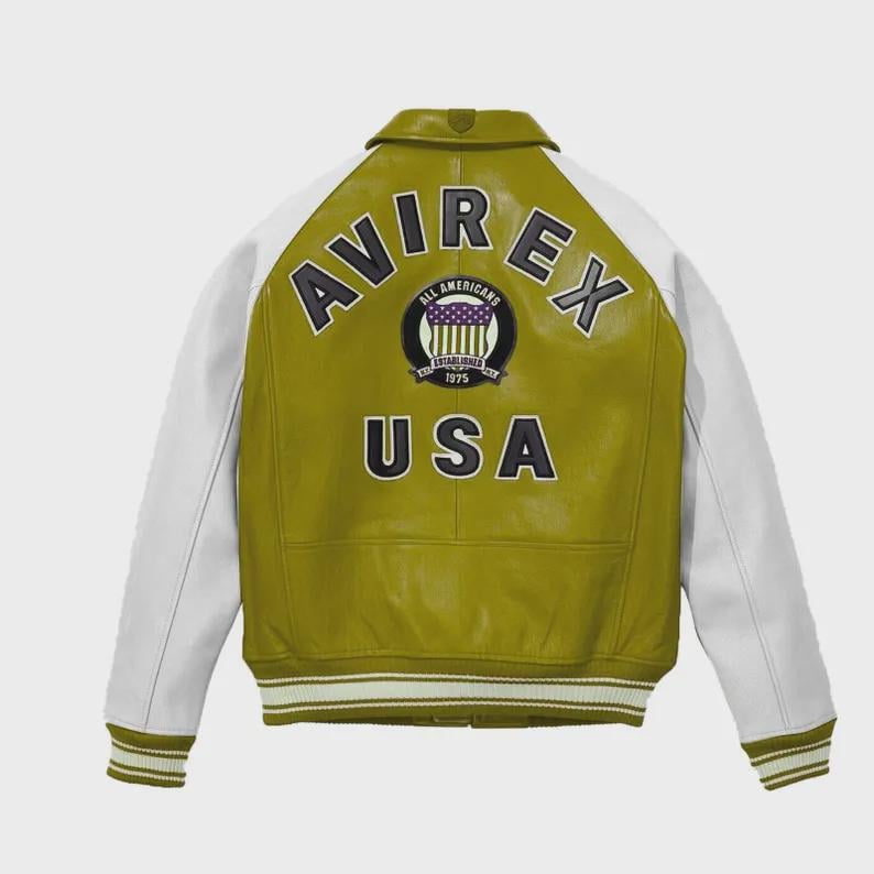 May include: A green and white leather jacket with the text "AVIREX" arched across the top and "USA" at the bottom. The jacket has white sleeves and a striped cuff. A circular patch with text and a flag design is centered on the back.