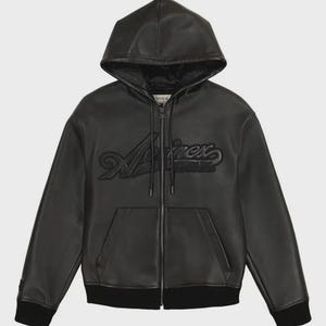 May include: Black leather zip-up hoodie with a drawstring hood and front pockets. The word "A/irex" is embossed across the chest. The jacket has a black ribbed hem and cuffs. A casual outerwear garment.