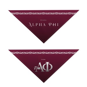 May include: Two maroon triangular bandanas with white decorative trim. The top bandana has the text "VEARA" above "ALPHA PHI" in a serif font. The bottom bandana has the text "VEARA" above the Greek letters "AΦ".