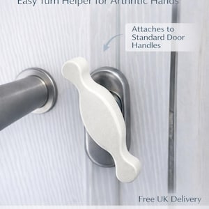 May include: A white EasyGrip door handle attached to a standard door handle. The product is designed to assist those with arthritis. The image text reads "EasyGrip Door Handle" and "Easy Turn Helper for Arthritic Hands."