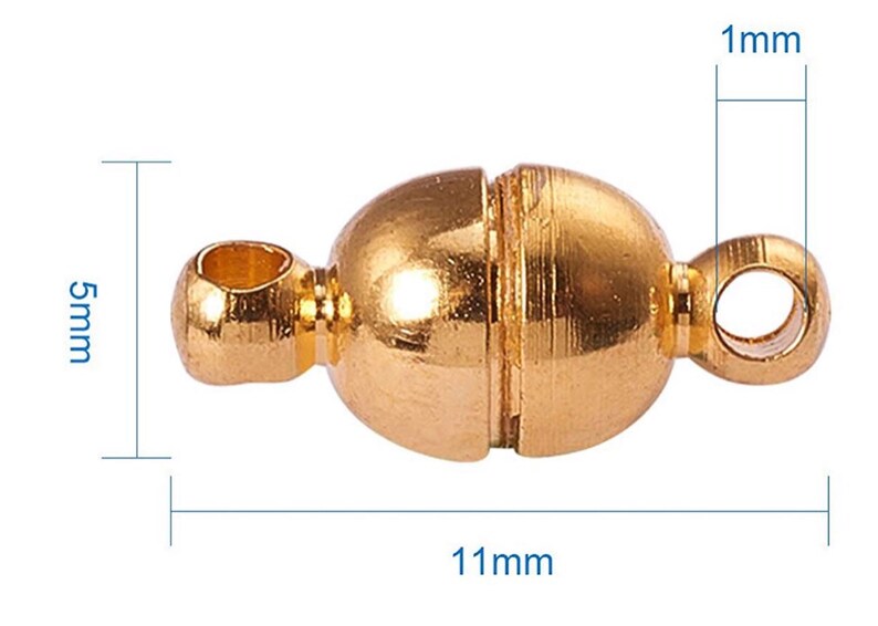 May include: A gold-colored magnetic clasp for jewelry making. The clasp is oval-shaped, measuring 11mm long, 5mm high, and 1mm thick. It features two loops for attaching to jewelry pieces and a magnetic closure in the center.