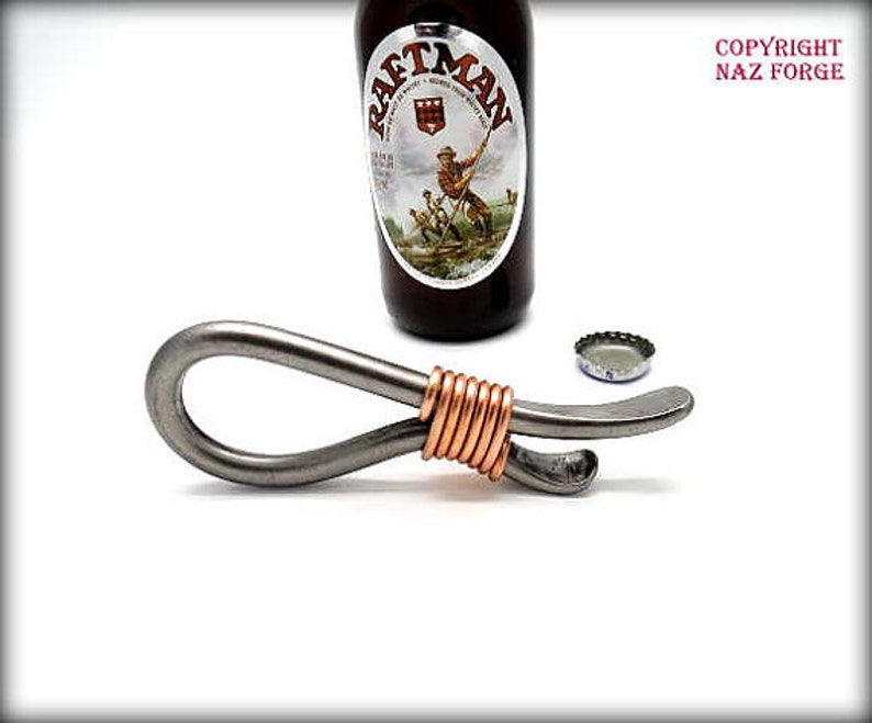 May include: A silver bottle opener with a copper wire wrapped around the handle. The opener is designed to open bottles with a twist-off cap.