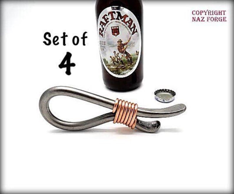 May include: Set of four silver bottle openers with copper wire accents. The openers are shaped like a loop with a bottle opener on one end.