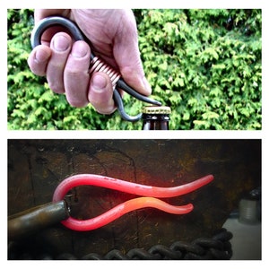 May include: A close-up of a metal bottle opener being used to open a bottle. The opener is made of a single piece of metal and has a unique shape. The bottle is brown glass and has a gold cap. The opener is being held by a hand, and the bottle is on a table.