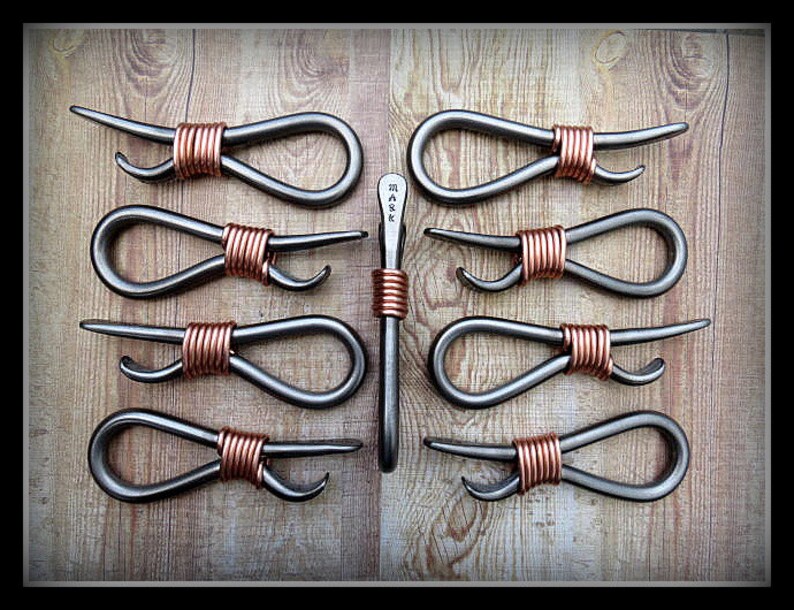 May include: Ten metal bottle openers with copper wire wrapped handles. The openers are shaped like a figure eight and have a bottle opener on one end.