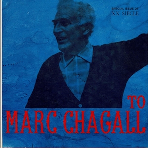 May include: A blue and white magazine cover with the title "HOMAGE TO MARC CHAGALL" in red text. The cover features a photo of a man in a blue shirt and black sweater, smiling. The text "SPECIAL ISSUE OF XX SIECLE" is in the upper right corner.