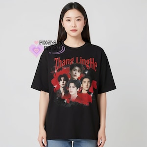 May include: Black t-shirt featuring a group of five people with the text "Zhang LingHe" in red. The shirt has a vintage style design with a red background behind the group of people.