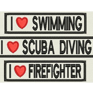 May include: Three black and white rectangular patches with a red heart and the text "I love" followed by "SWIMMING", "SCUBA DIVING", and "FIREFIGHTER".