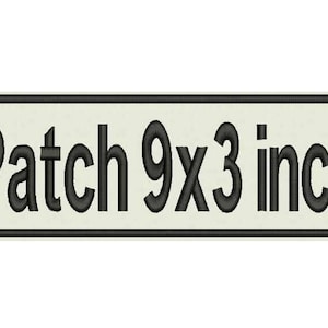 May include: A white rectangular patch with a black border and the text "Patch 9x3 inch" in black.