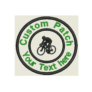 May include: Black and green embroidered patch with a cyclist silhouette and the text "Custom Patch Your Text Here".