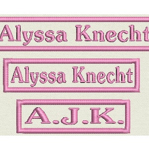 May include: Three pink embroidered name tags with the name "Alyssa Knecht" in a larger font and the initials "A.J.K." in a smaller font.