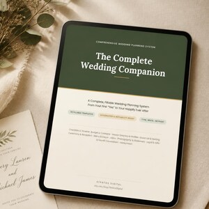 May include: A tablet displaying a digital wedding planning system titled The Complete Wedding Companion. The screen features a dark green header, white text, and sections for templates, checklists, budget, and vendor details by Stratos Digital.
