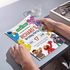 May include: A colorful Sesame Street birthday party invitation featuring Cookie Monster, Big Bird, Elmo, and other characters. The invitation reads "Richard's Birthday Party" with the date and time.
