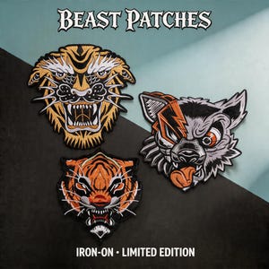 May include: Three embroidered patches featuring animal heads with the text BEAST PATCHES and IRON-ON LIMITED EDITION. The top left patch is a gold and black tiger, the bottom left is an orange and black tiger, and the right is a grey and orange wolf.