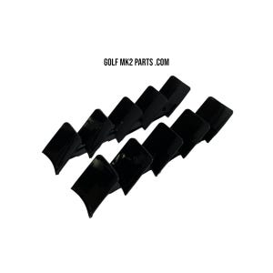 May include: Ten glossy black plastic automotive parts are arranged diagonally against a white backdrop. The text "GOLF MK2 PARTS .COM" is displayed in black at the top of the image.