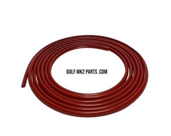 May include: Coiled, dark red rubber tubing. The tubing is circular and appears to be flexible. The text "GOLF MK2 PARTS .COM" is printed in white.