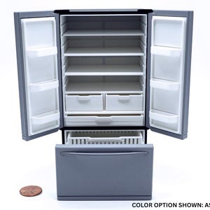 May include: An ash gray miniature refrigerator with two open doors, four interior shelves, two small drawers, and one large bottom pull-out drawer. A copper penny is placed to the left for scale, and the text reads: COLOR OPTION SHOWN: ASH GRAY.