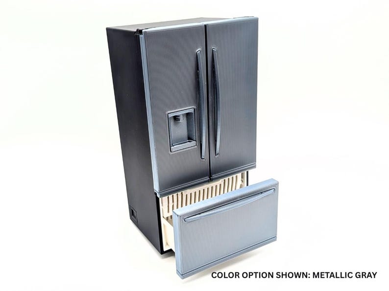 May include: A metallic gray refrigerator with a black side panel, two vertical doors, and a bottom freezer drawer. The unit features a water dispenser on the left door and includes the text COLOR OPTION SHOWN: METALLIC GRAY at the bottom right.