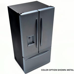 May include: A metallic gray refrigerator with a black exterior frame, featuring a French door design with vertical handles, a bottom freezer drawer, and an integrated water and ice dispenser on the left door. The text reads: COLOR OPTION SHOWN: METALLIC GRAY.
