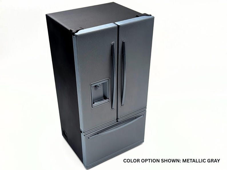 May include: A metallic gray refrigerator with a black exterior frame, featuring a French door design with vertical handles, a bottom freezer drawer, and an integrated water and ice dispenser on the left door. The text reads: COLOR OPTION SHOWN: METALLIC GRAY.