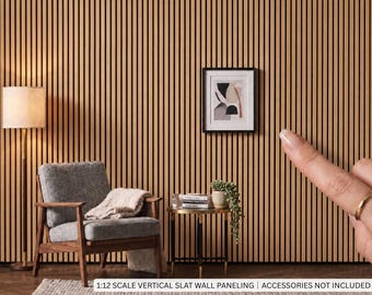 May include: A 1:12 scale vertical slat wall paneling featuring light brown wooden slats with thin black gaps between them. The paneling is displayed as a miniature wall covering, with text at the bottom stating 1:12 SCALE VERTICAL SLAT WALL PANELING.