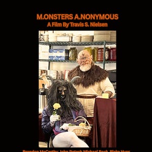 May include: Movie poster for "M.ONSTERS A.NONYMOUS" by Travis S. Nielsen. The poster features two costumed figures, one with a horned face and the other with long black hair, holding a yellow rose. The film's title and credits are displayed in orange text.