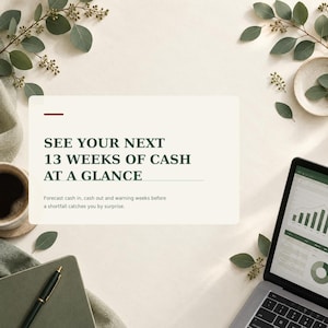 May include: A rectangular sign with dark green text reading SEE YOUR NEXT 13 WEEKS OF CASH AT A GLANCE and Forecast cash in, cash out and warning weeks before a shortfall catches you by surprise, positioned near a laptop, notebook, and coffee.