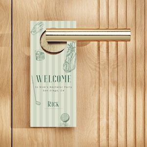 May include: A door hanger with a golf theme, featuring a green and white striped background. The text "WELCOME" is displayed, along with golf-related illustrations and the name "Rick". The hanger is designed for a bachelor party in San Diego, CA.