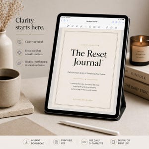 May include: A digital tablet displaying "The Reset Journal" with text about mental clarity and emotional reset. The image includes a candle, books, a pen, and a coffee cup, suggesting a focus on mindfulness and self-care.
