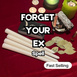 May include: A collection of spiritual items on a red surface, including white candles, a deck of cards, sage, bay leaves, and lit candles. The text "FORGET YOUR EX Spell" is displayed. The words "Fast Selling" are also visible.