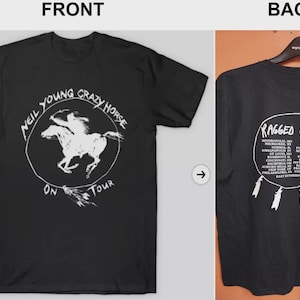 May include: Black t-shirt featuring a white graphic of a horse and rider inside a circle, with the text "NEIL YOUNG CRAZY HORSE ON TOUR." The back of the shirt displays "RAGGED GLORY" and a list of tour dates.