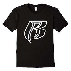 May include: Black t-shirt with a white, stylized letter "B" graphic. The design is outlined in a bold, clean style. The shirt has short sleeves and a crew neck.