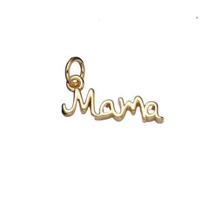 May include: A gold-colored charm in the shape of the word "Mama" in a cursive font. The charm has a small loop at the top for attaching to a necklace or bracelet. The charm is on a white background.
