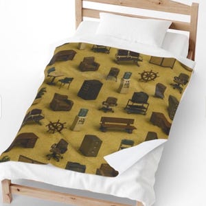 May include: A tan blanket with a repeating pattern of miniature brown office furniture, including chairs, desks, and cabinets. The blanket is on a wooden bed frame with a white pillow and sheets.
