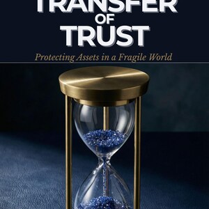 May include: Book cover titled "The Transfer of Trust" with an hourglass. The hourglass has a brass frame and contains blue crystals. The book's subtitle reads "Protecting Assets in a Fragile World". The author's name is Carl M. Westberg.