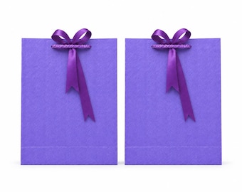 May include: Two rectangular purple gift bags with a textured surface. Each bag features a deep purple satin ribbon tied into a bow at the top center, serving as a handle. The bags are identical in color, shape, and design, standing side by side.