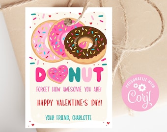 Op de afbeelding: Een roze en witte Valentijnskaart met een donutthema. De kaart toont drie donuts met roze glazuur en sprinkles, en een chocolade donut met sprinkles. De tekst op de kaart luidt "DONUT forget how awesome you are! Happy Valentine's Day! Your friend, Charlotte".