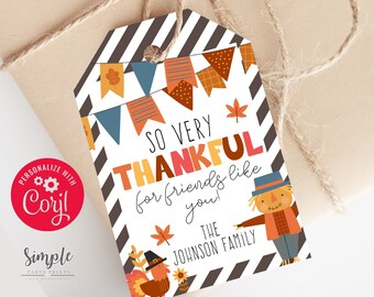 May include: A printable Thanksgiving gift tag with a black and white striped background. The tag features a scarecrow and a turkey with the text "So Very Thankful for friends like you! The Johnson Family".