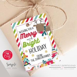 May include: A white gift tag with a red and green striped border. The tag features a cartoon reindeer, a snowman, and a Christmas tree. The text on the tag reads "Wishing you a Merry and Bright Holiday from: The Johnson Family".
