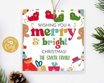 May include: A white gift tag with a colorful illustration of gingerbread men, elves, and presents. The text reads "Wishing you a merry & bright Christmas! The Smith Family."