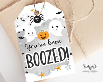 May include: A white tag with a gray watercolor background and a black spider, two white ghosts, and an orange pumpkin. The tag says "You've been BOO-ZED!" with black text.