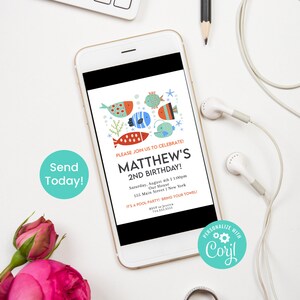 Peut inclure: Un &eacute;cran de smartphone bleu et blanc affichant une invitation color&eacute;e pour le 2&egrave;me anniversaire de Matthew. L'invitation pr&eacute;sente une illustration de poissons de dessin anim&eacute; et le texte "Veuillez vous joindre &agrave; nous pour c&eacute;l&eacute;brer ! Le 2&egrave;me anniversaire de Matthew !" L'invitation comprend la date, l'heure, le lieu et les informations de RSVP.