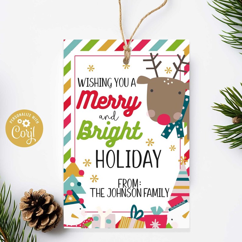 May include: A white gift tag with a red and green striped border. The tag features a cartoon reindeer with a red nose and a blue scarf. The text on the tag reads "Wishing you a Merry and Bright Holiday" and "From: The Johnson Family".