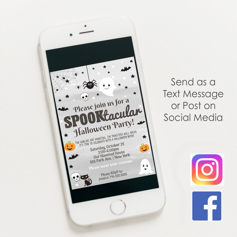 May include: A smartphone screen shows a Halloween party invitation with a spooky theme. The invitation features text: "Please join us for a SPOOKtacular Halloween Party!" with event details. The phone is placed on a white surface.