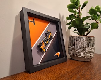 F1 McLaren Lando Norris car and 'No.4' artwork in ‘Play or Display’ black box frame