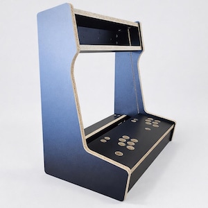 May include: A blue and black arcade cabinet with a gradient effect. The cabinet has a rectangular base with pre-drilled button holes and a top section for a monitor. The sides are curved, and the edges are unfinished.