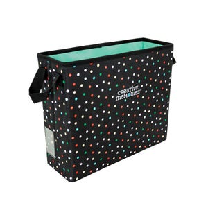May include: Black storage tote with colorful polka dots. The tote has black handles and a mint green interior. The words "Creative Memories" are printed on the side. This tote is designed for organizing scrapbooking supplies.